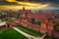 Misty sunrise over the Malbork castle and Nogat river in Poland Royalty Free Stock Photo