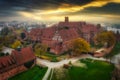 Misty sunrise over the Malbork castle and Nogat river in Poland Royalty Free Stock Photo