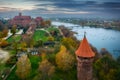 Misty sunrise over the Malbork castle and Nogat river in Poland Royalty Free Stock Photo