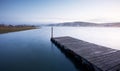 Misty sunrise over river and pier Royalty Free Stock Photo