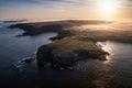 Misty sunrise over the rocky coast of Kilkee, Co. Clare. Ireland