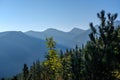 misty sunrise in Slovakian Tatra mountains with light lanes in f