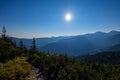 misty sunrise in Slovakian Tatra mountains with light lanes in f