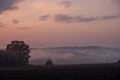 misty sunset, plowed field, red clouds, fairytale landscape