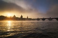 Misty towers of Charles bridge at Vltava river during foggy sunrise, Prague, Czech republic Royalty Free Stock Photo