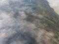 Misty trees from above. Aerial view of Morning fog and sunrise in autumn. Beautiful romantic atmosphere in landscape. Summer time Royalty Free Stock Photo