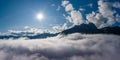 Misty view to mount hahnenkamm at hoefen reutte with cloud bank