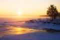 Misty winter sunrise over a frozen lake Royalty Free Stock Photo