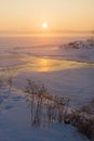 Misty winter sunrise over a frozen lake Royalty Free Stock Photo