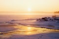 Misty winter sunrise over a frozen lake Royalty Free Stock Photo