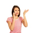 Misunderstanding and distant call young woman talking on mobile phone has many questions. emotional girl isolated on white backgro Royalty Free Stock Photo