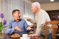 Misunderstanding between senior father and son Royalty Free Stock Photo