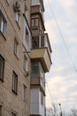 Misunderstood balconies on the wall of the apartments. Different in shape, size, material and construction balconies one above the