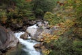 Mitake Shosenkyo gorges and moutain stream with red autumn leaves