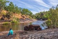 Mitchell Plateau WA Australia - May31 2015: An indigenous Australian woman from the local Kandiwal community sits beside a Royalty Free Stock Photo