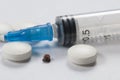 Mite, tablets and syringe Royalty Free Stock Photo