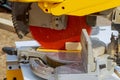 Miter Saw on a construction site with a worker in contractor uses a circular saw to cut and trim Royalty Free Stock Photo