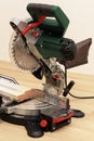 Miter saw with a round sharp blade ready to cut the part to size. Carpenter power tool Royalty Free Stock Photo
