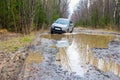 Mitsubishi crossover overcomes a dirty road