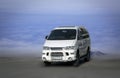 Mitsubishi Delica white minibus.