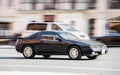 Mitsubishi Eclipse car driving on freeway, motion blur. View of road with old auto in motion