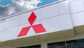 Mitsubishi logo on the modern building facade. Editorial 3D rendering Royalty Free Stock Photo