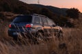 Mitsubishi outlander turbo in mountain road during sunset Royalty Free Stock Photo