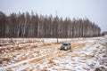 Mitsubishi Pajero/Montero at dirt road in winter forest