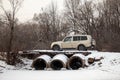 Mitsubishi Pajero/Montero at old bridge in winter forest