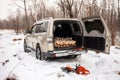 Mitsubishi Pajero/Montero in winter forest with firewood in the trunk