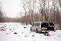 Mitsubishi Pajero/Montero in winter forest with firewood in the trunk