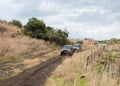 Mitsubishi Pajero SUVs ride on a country road near the Jordan River in the Golan Heights in northern Israel