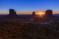 The Mittens, three buttes in Monument Valley at sunrise, Arizona and Utah, USA Royalty Free Stock Photo