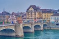 Mittlere Brucke across Rhine river with small chapel on the middle, Basel, Switzerland