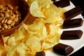 Nuts, chips and chocolate put together Royalty Free Stock Photo
