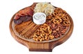 Mix of beer snacks on round wooden board Royalty Free Stock Photo