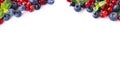 Mix berries and fruits at border of image with copy space for text. Ripe blueberries, red and black currants on white Royalty Free Stock Photo
