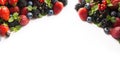 Mix berries and fruits on a white. Berries and fruits at border of image with copy space for text. Black-blue and red food. Ripe b Royalty Free Stock Photo