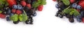 Mix berries on a white background. Berries and fruits at border of image with copy space for text. Black-blue and red food. Ripe b Royalty Free Stock Photo