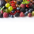 Mix berries on a white background. Ripe red currants, grapes, blackberries, blueberries and raspberries on white background. Top v Royalty Free Stock Photo