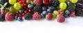 Mix berries on a white background. Ripe red currants, grapes, blackberries, blueberries and raspberries on white background. Royalty Free Stock Photo