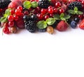 Mix berries on a white background. Ripe red currants, strawberries, blackberries, blueberries, blackcurrants, gooseberries with mi Royalty Free Stock Photo