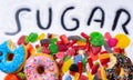 Mix of candies donuts and sugar in writing Royalty Free Stock Photo