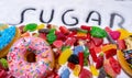 Mix of candies donuts and sugar in writing Royalty Free Stock Photo