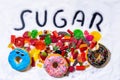 Mix of candies donuts and sugar in writing Royalty Free Stock Photo