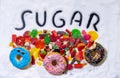 Mix of candies donuts and sugar in writing Royalty Free Stock Photo