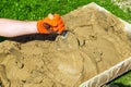 Mix the cement with sand and water with a trowel. Builder is hand in a glove with a trowel during work Royalty Free Stock Photo