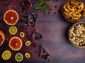 Mix of christmas spices, nuts, fresh and dried fruits, baking dish, christmas branch, selective focus Royalty Free Stock Photo