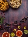 Mix of christmas spices, nuts, fresh and dried fruits, baking dish, christmas branch, selective focus Royalty Free Stock Photo