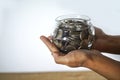 Mix coins and seed in clear bottle on white background,Business investment growth concept Royalty Free Stock Photo